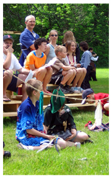 crowd watches from the bleachers