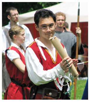 Harold pensively examines one of the scrolls he must announce.