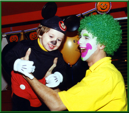 KooKoo the Clown swings Mickey Mouse in the air.